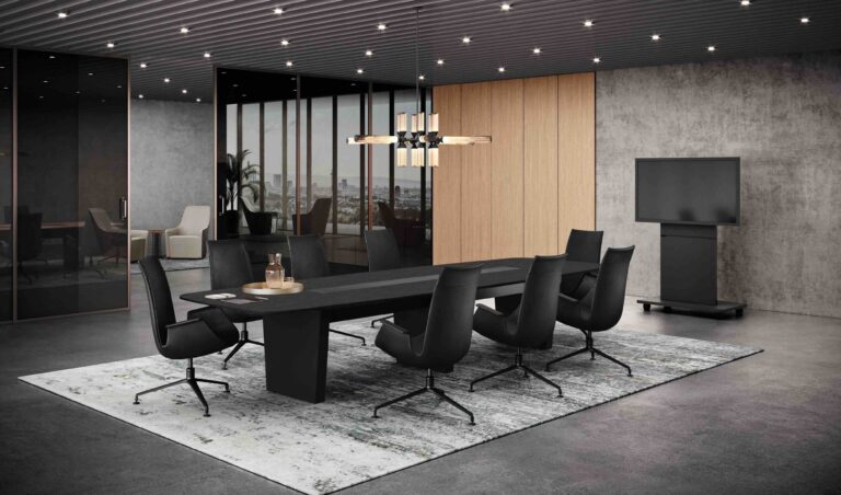 Ein exklusiv gestalteter Boardroom mit großem Konferenztisch, Designerstühlen und einer mobilen Medienstele zeigt eine hochwertige Einrichtung von Walter Knoll für professionelle Besprechungen mit Präsentationstechnik.