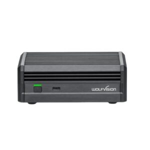 Kompakter schwarzer Encoder-Decoder mit geriffeltem Gehäuse, grüner Statusanzeige und WolfVision-Logo in frontaler Ansicht vor weißem Hintergrund.